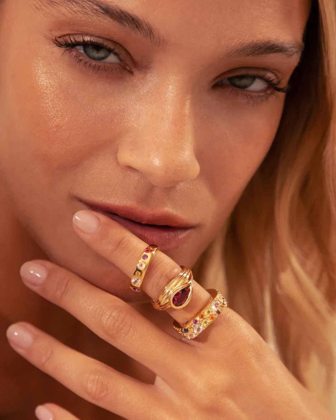 Sreni Ring with a single band row of bloom-like stones, resembling a miniature garden line.