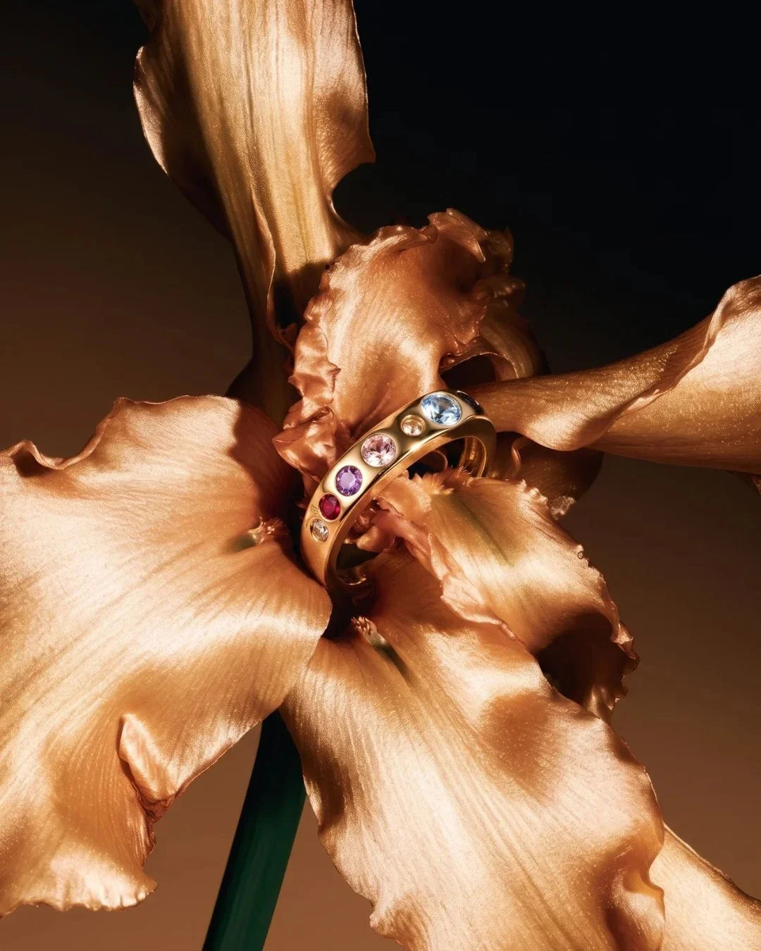 Sreni Ring featuring a single band with a row of floral-inspired stones resembling a miniature garden