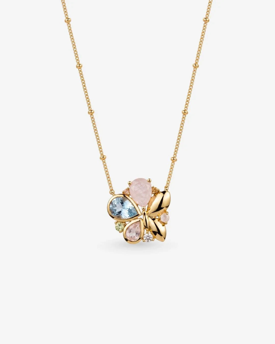 Titli Necklace featuring pastel stones in butterfly design caught mid-flight and mid-landing
