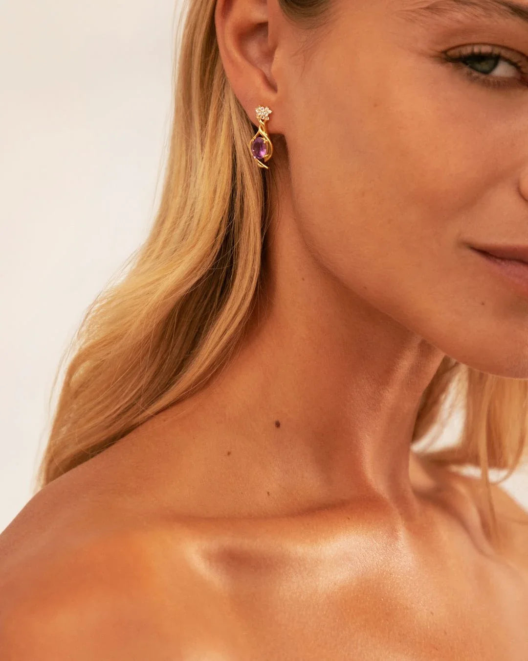 Gold Vallari earrings with vine design and amethyst accents
