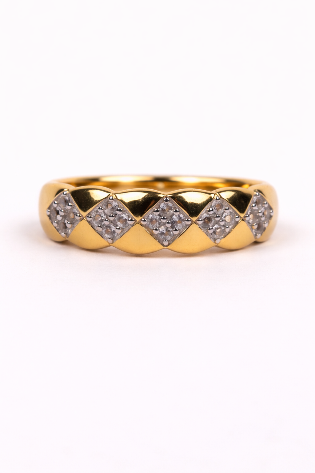 Taal Ring gold band with white topaz stones in a balanced rhythmic pattern