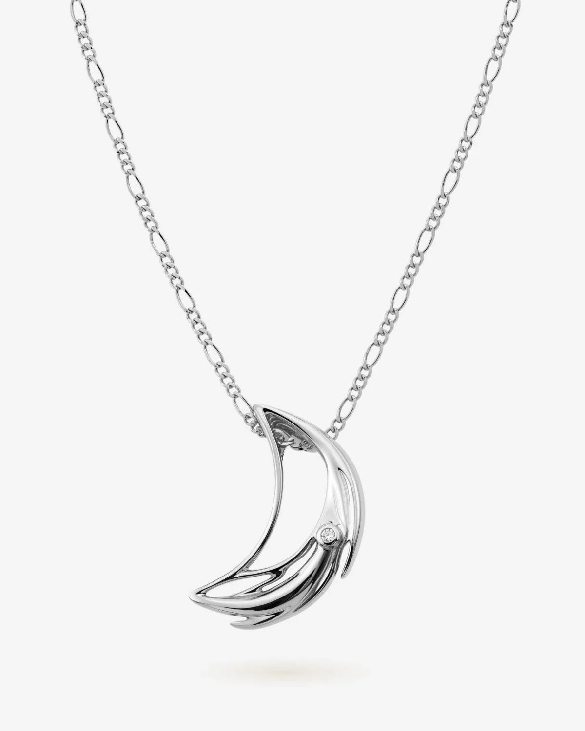 D डी Initial Necklace in polished silver-tone metal, featuring a flowing curved D-shaped pendant with a small clear stone.