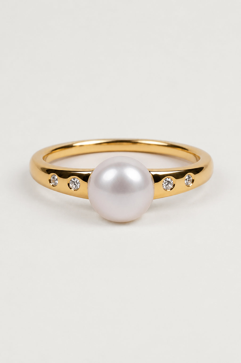 Deepa Ring with central pearl surrounded by lab-grown diamonds radiating light
