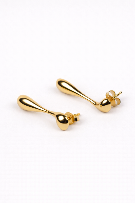 Minimal sculptural Dhara Earring with elongated fluid curve and soft yet strong design
