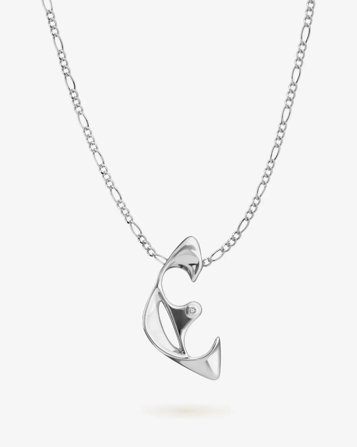 E ई Initial Necklace in polished silver-tone metal, featuring a sculpted letter E pendant with a small clear stone.