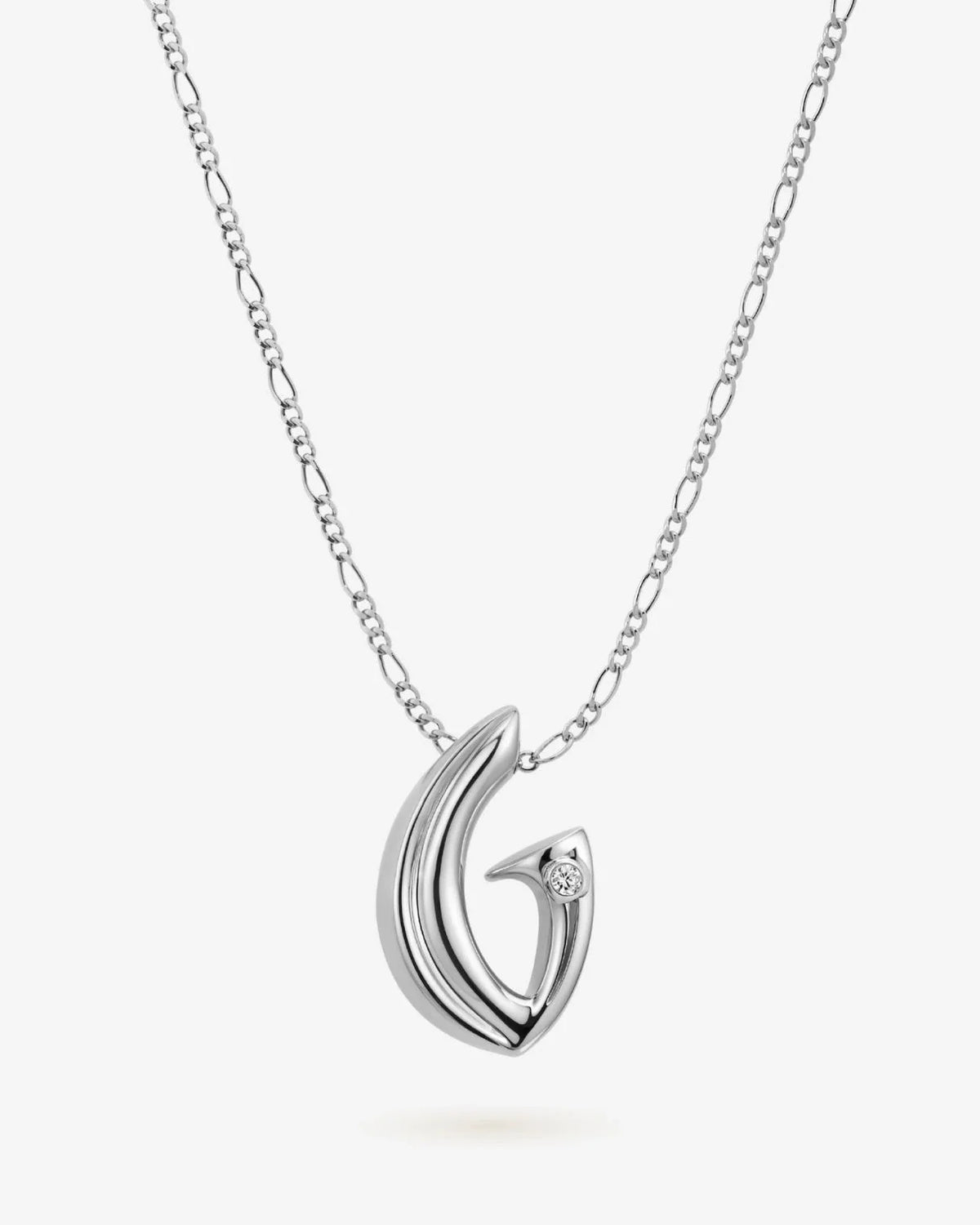 G जी Initial Necklace with a polished silver-tone metal pendant shaped like a stylized G, accented by a small clear stone.