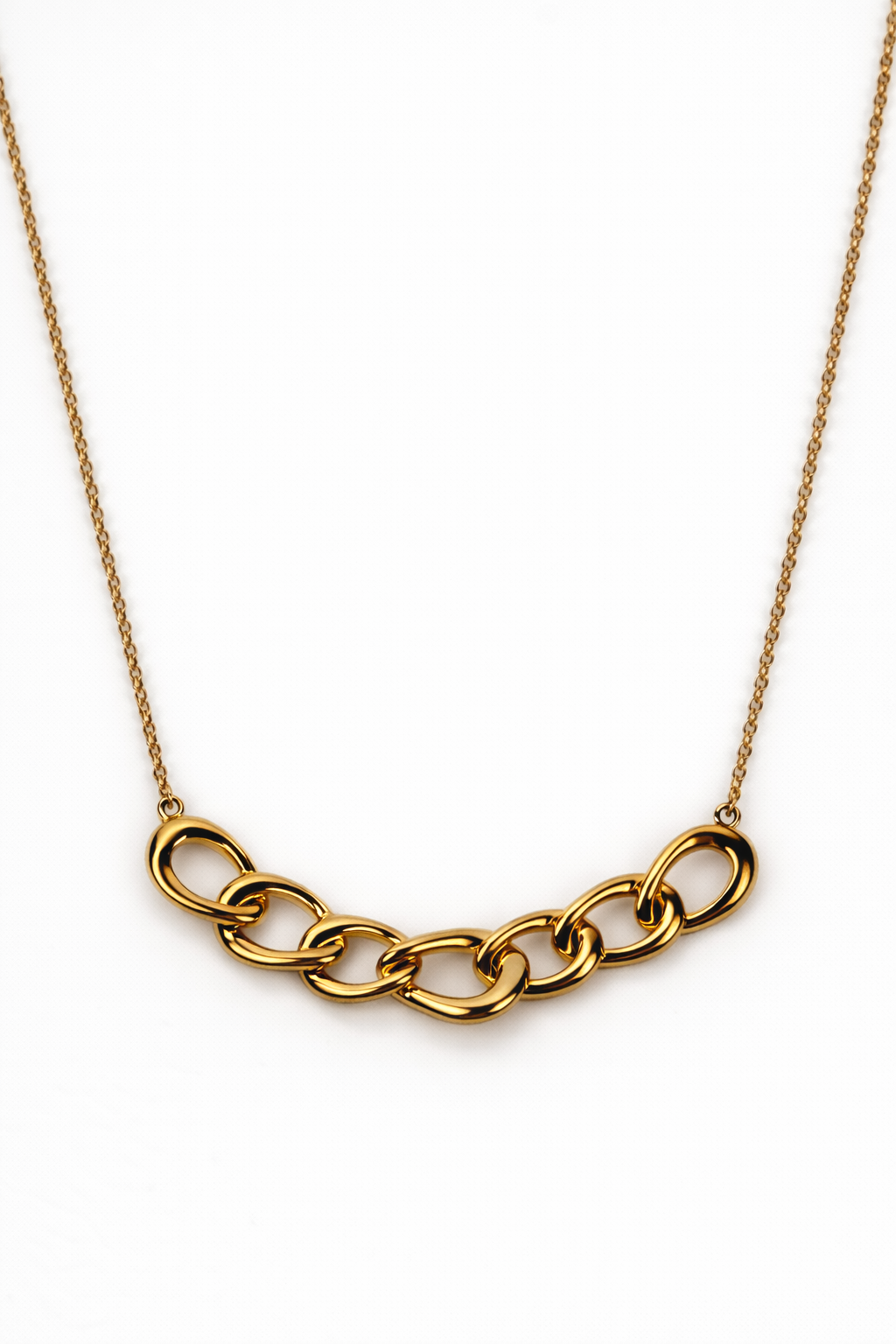 Gaath Necklace elegantly resting along the neckline with softly linked forms and a fluid design