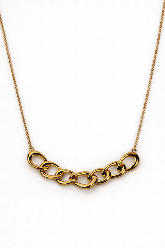 Gaath Necklace elegantly resting along the neckline with softly linked forms and a fluid design