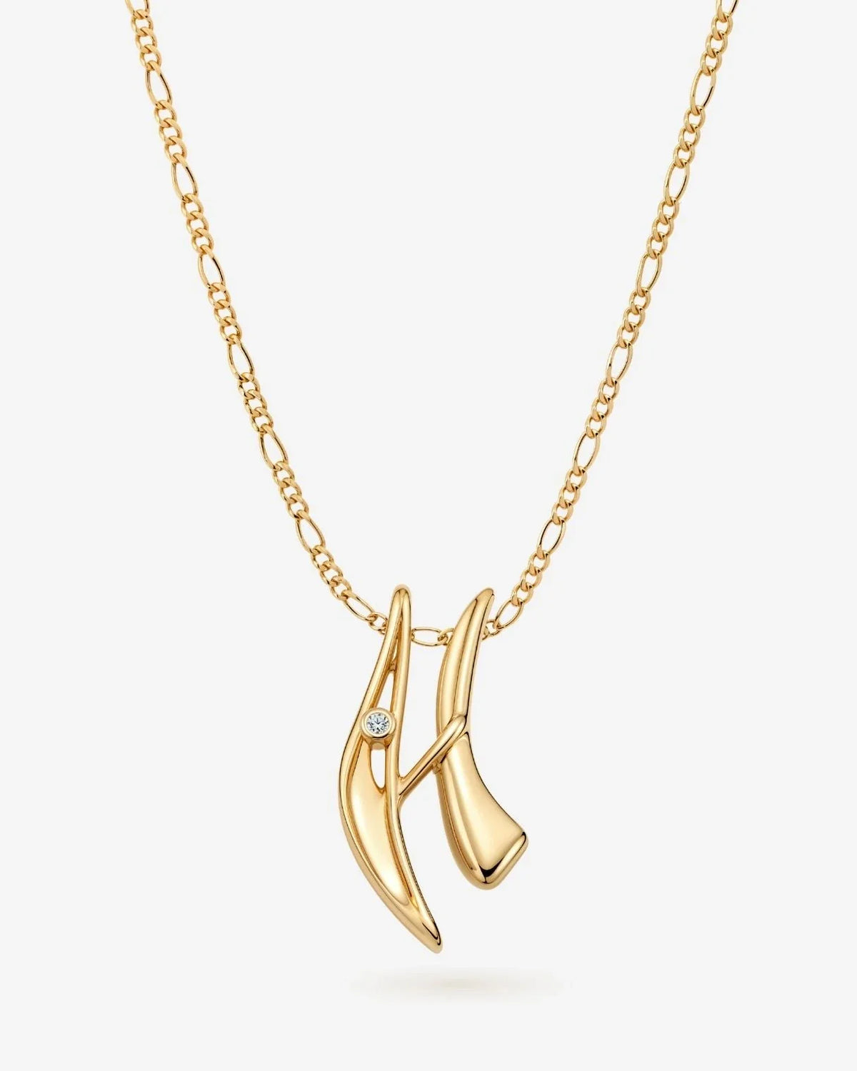 H एच Initial Necklace in polished gold-tone metal, featuring a sculptural letter pendant with a small clear accent stone.