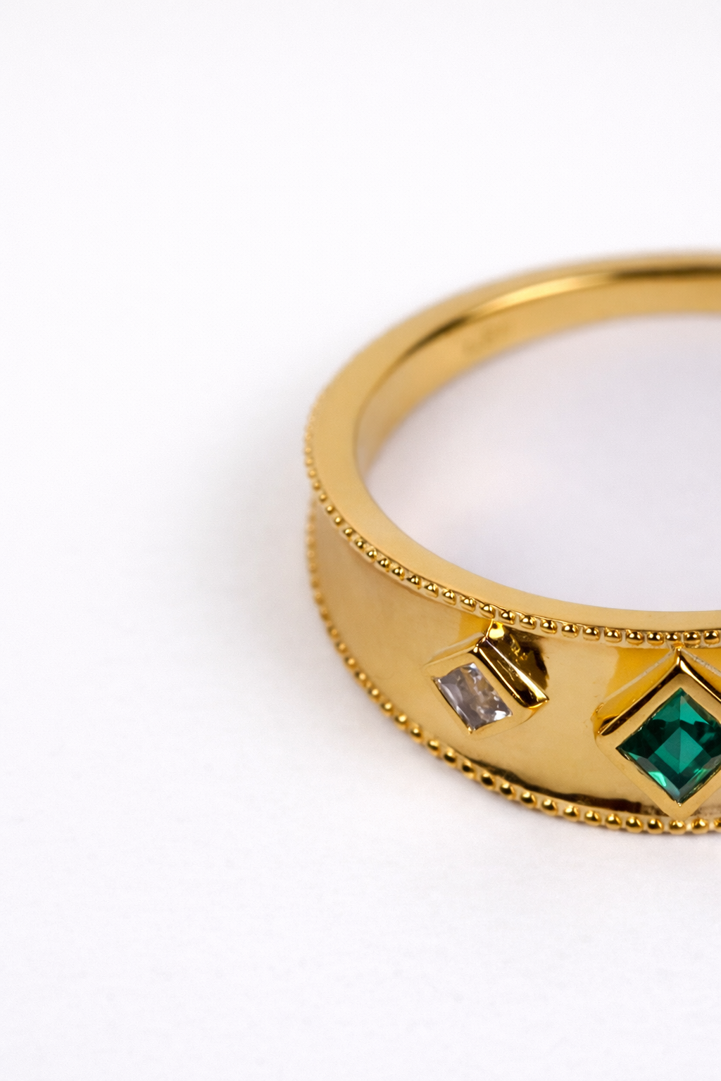 Harita Ring with lab-grown emerald and white topaz in gold setting