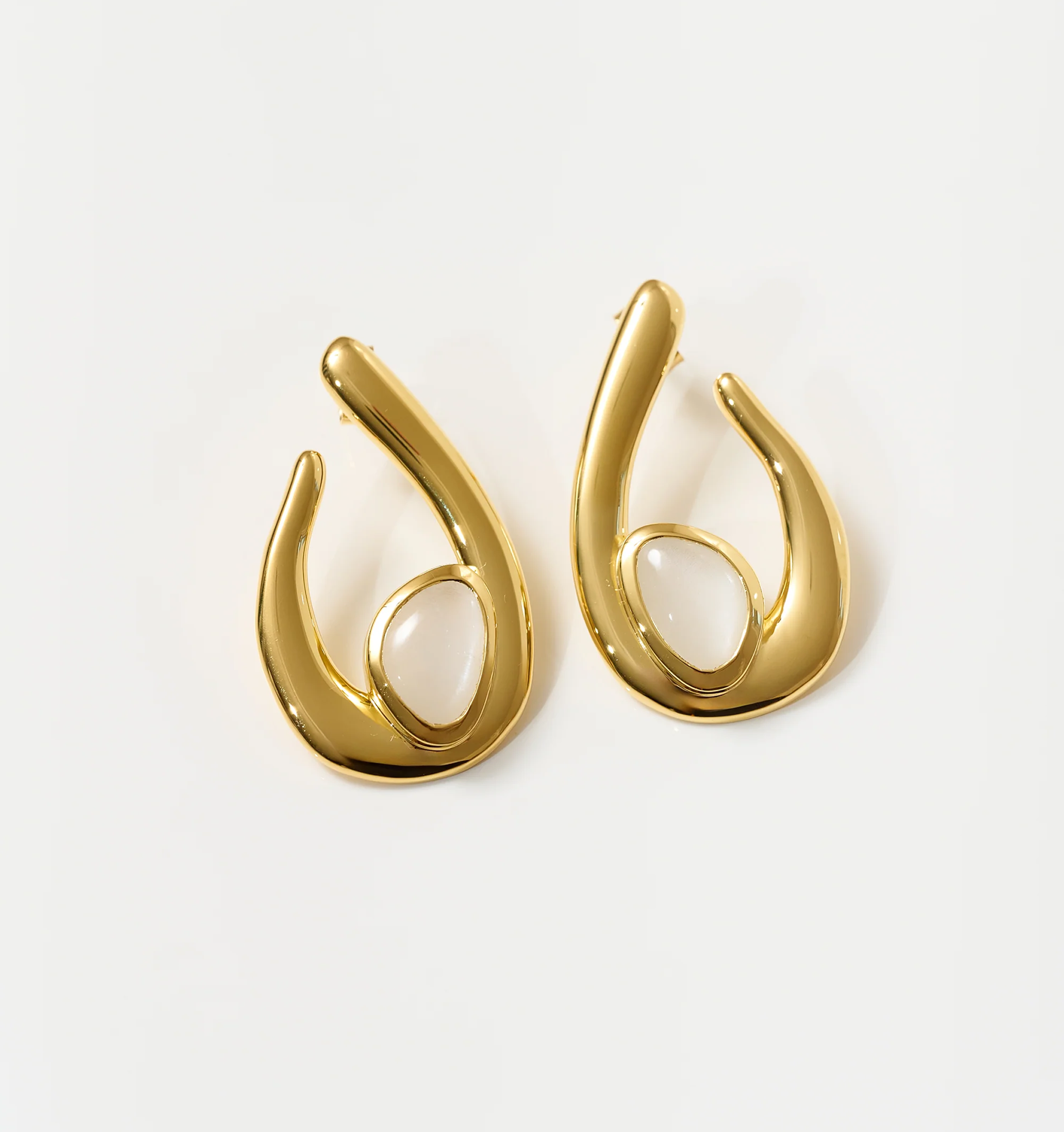 Lunara Earrings gold sculptural design with white moonstone centerpiece