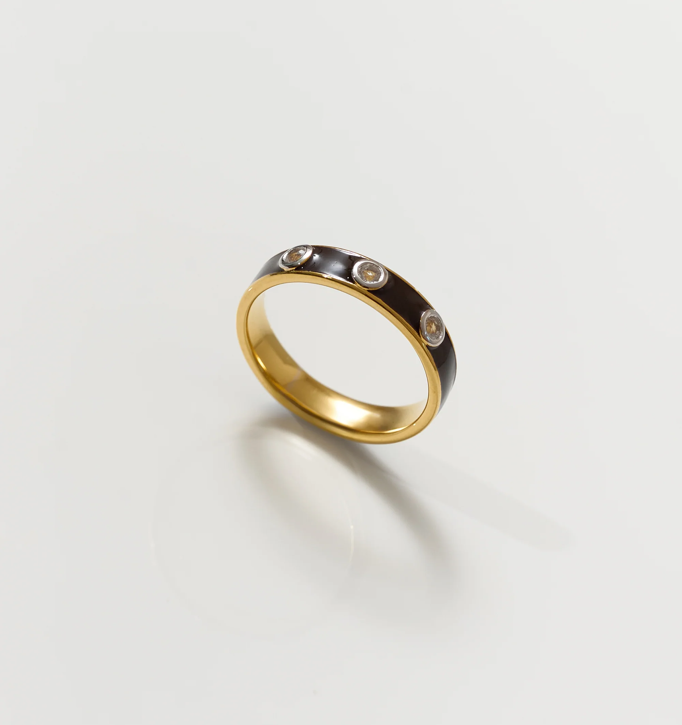Trikaala Ring gold band with black inlay and white stones reflecting time's cycle and lessons