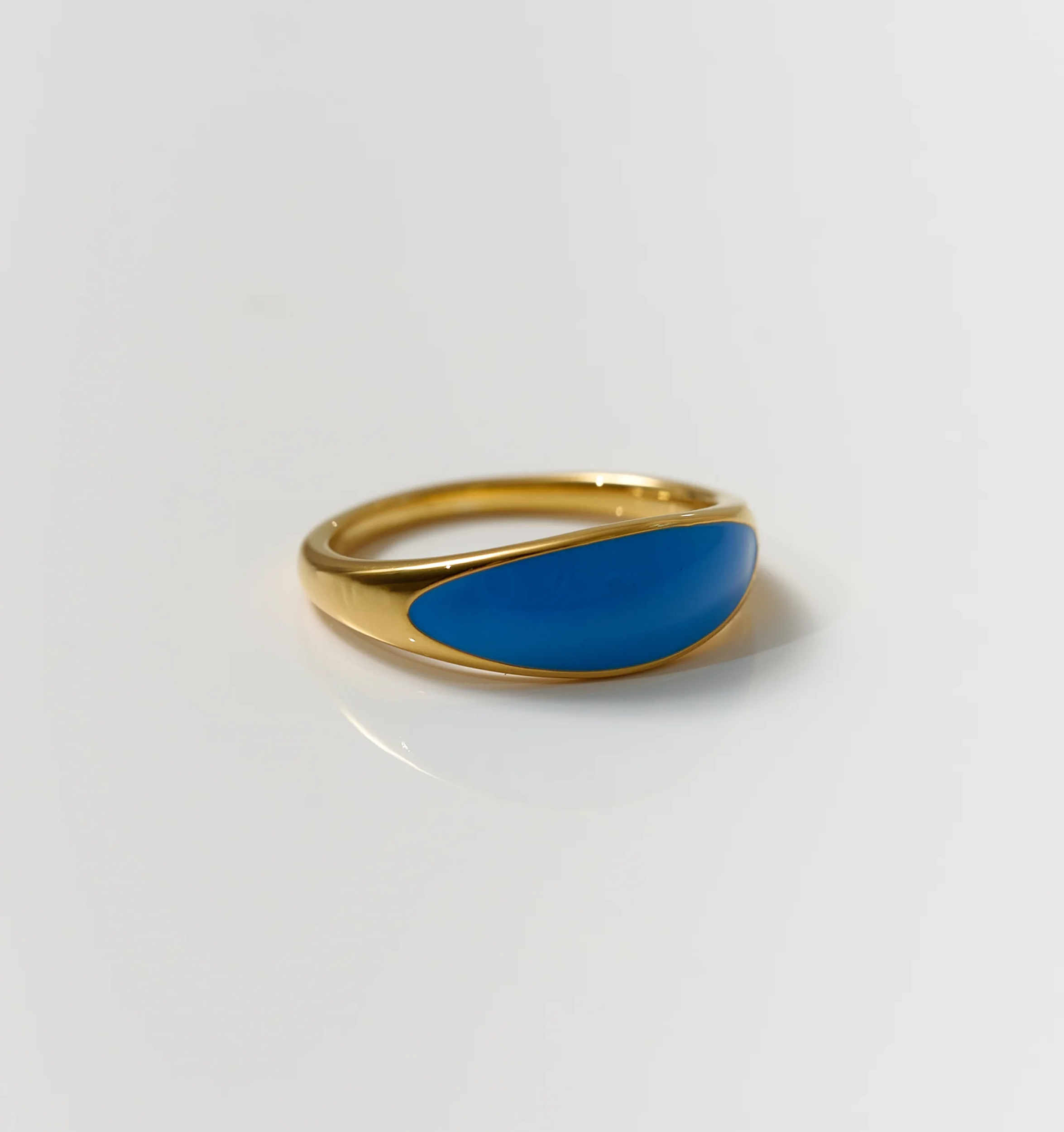 Neelra Ring gold band with smooth blue enamel inspired by water and tide motion