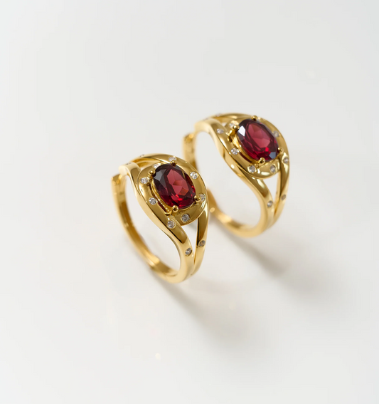Ruvya Hoops gold earrings with red garnet and white zircon gemstones on white background
