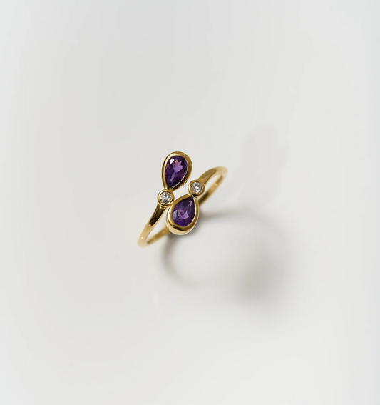 Nimira Ring with twin amethysts and white topaz set in gold band