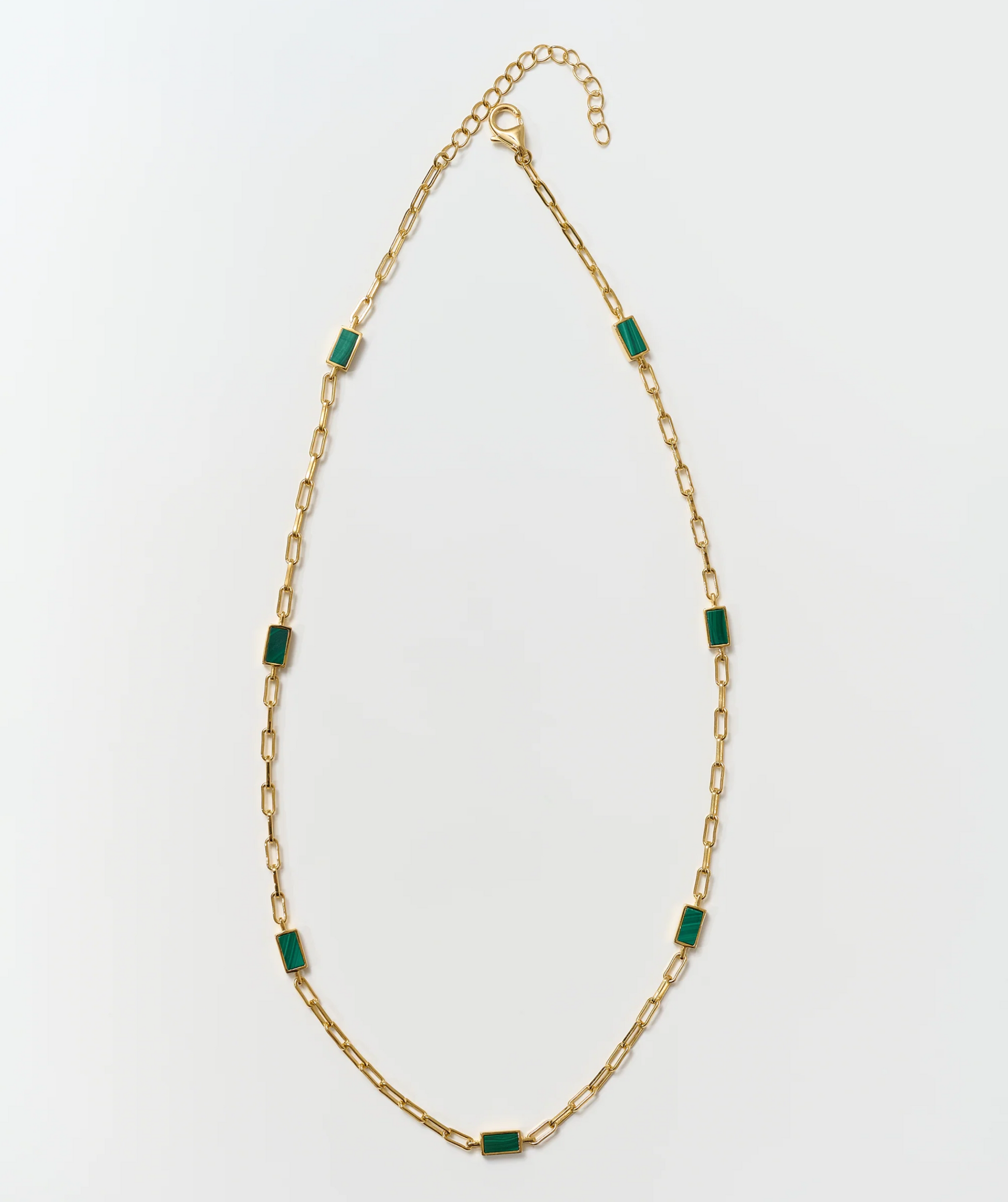 Tarang Necklace with seven green malachite stones on a gold chain balancing heart chakra energy