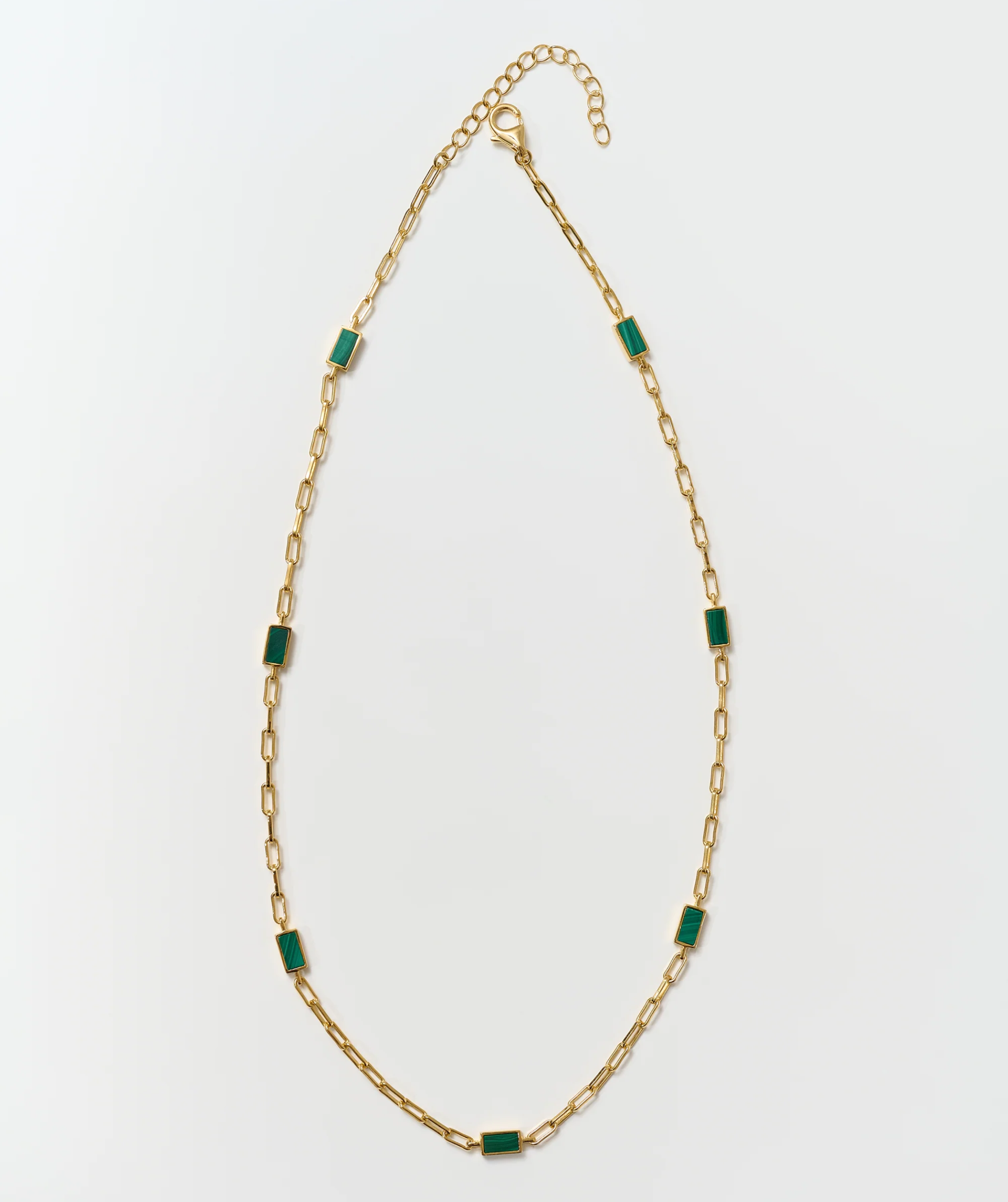 Tarang Necklace with seven green malachite stones on a gold chain balancing heart chakra energy