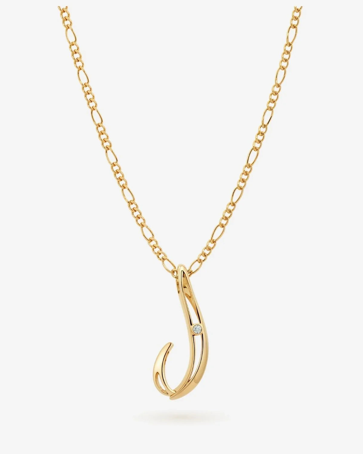 J जे Initial Necklace with a polished gold-tone chain and a curved J pendant accented by a tiny clear stone.