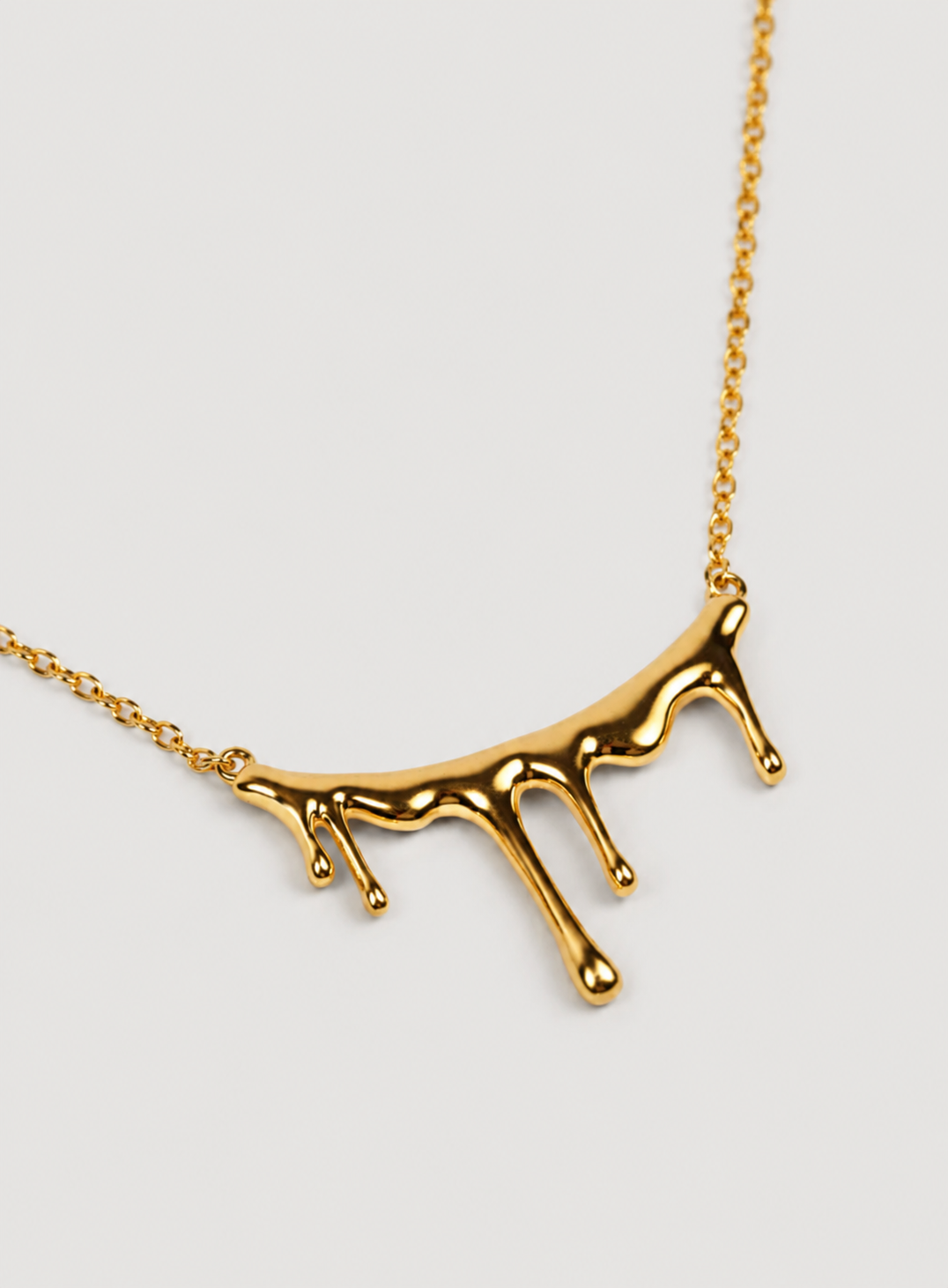 Close-up of Jharna Necklace with curved neckline and delicate cascading drops, showcasing elegant and modern design