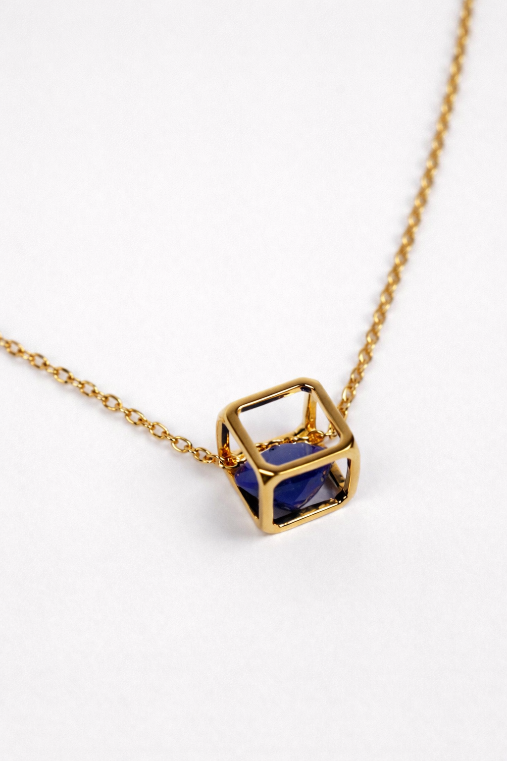 Kosha Necklace with round lapis lazuli stone in gold square frame