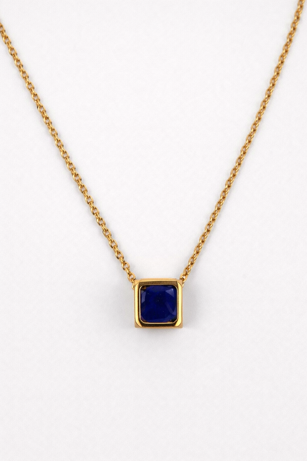 Kosha Necklace with round brilliant Lapis Lazuli stone inside gold square frame