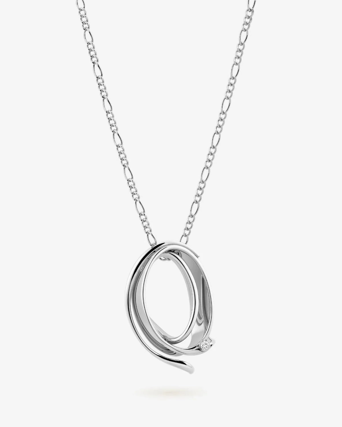 Q क्यू Initial Necklace in polished silver-tone metal, featuring a sculptural interlocking oval pendant and fine chain.