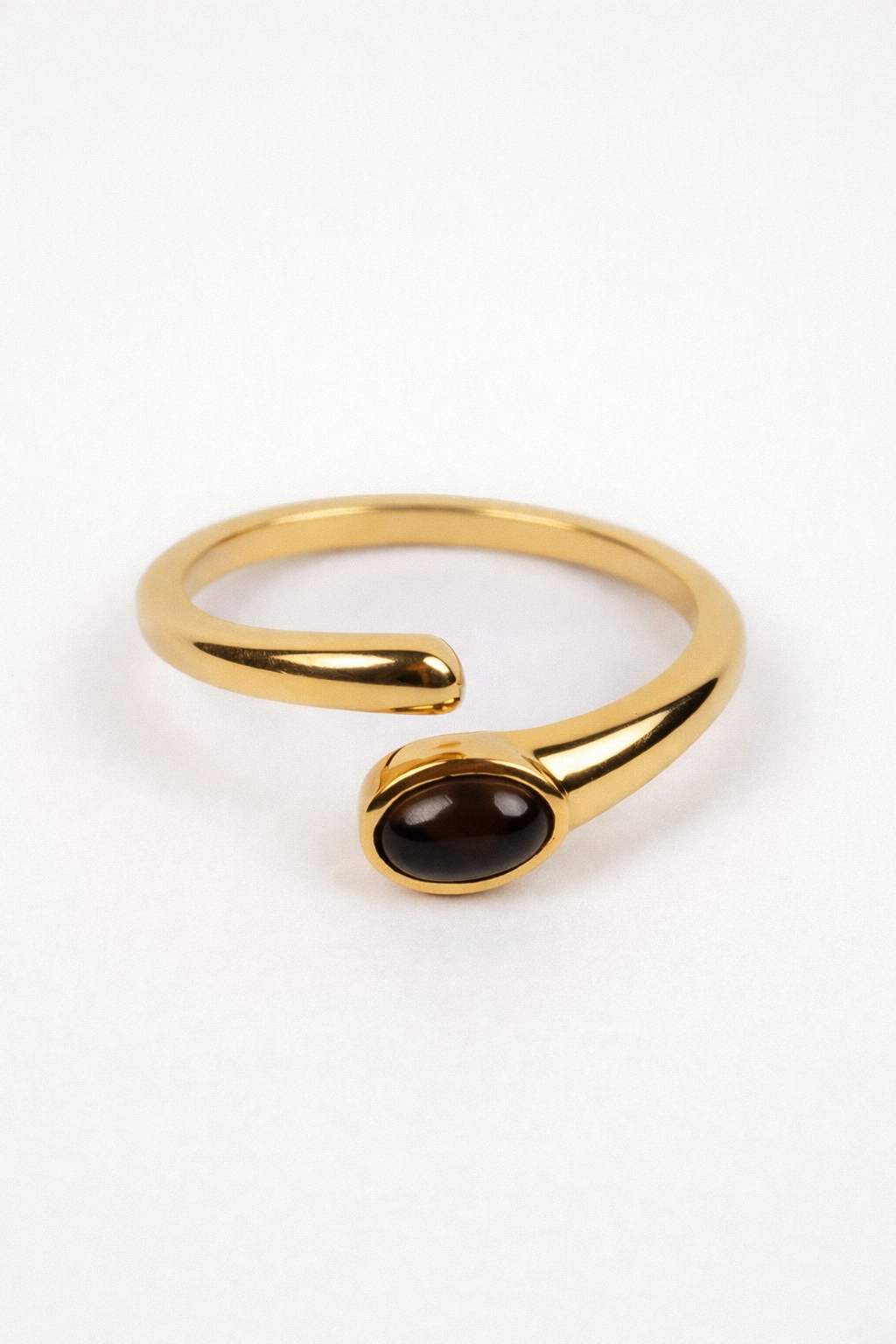 Raksh Ring with polished oval obsidian and open fluid form for daily protection and presence