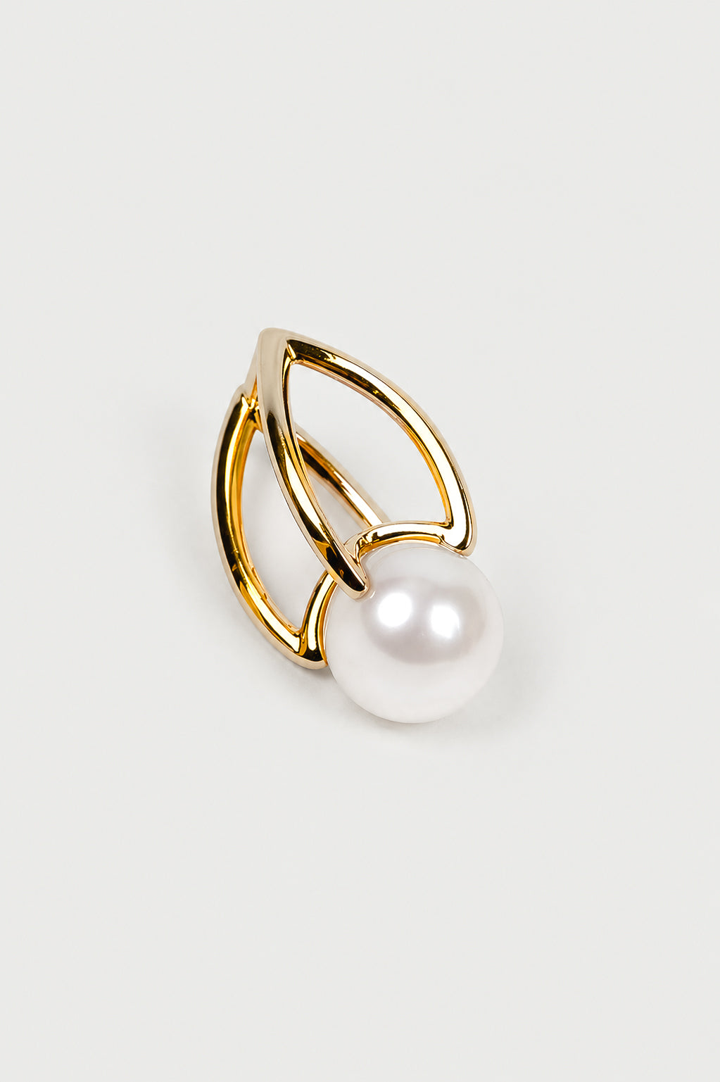 Shanta Earring with luminous pearl in open gold setting, showcasing modern and refined design