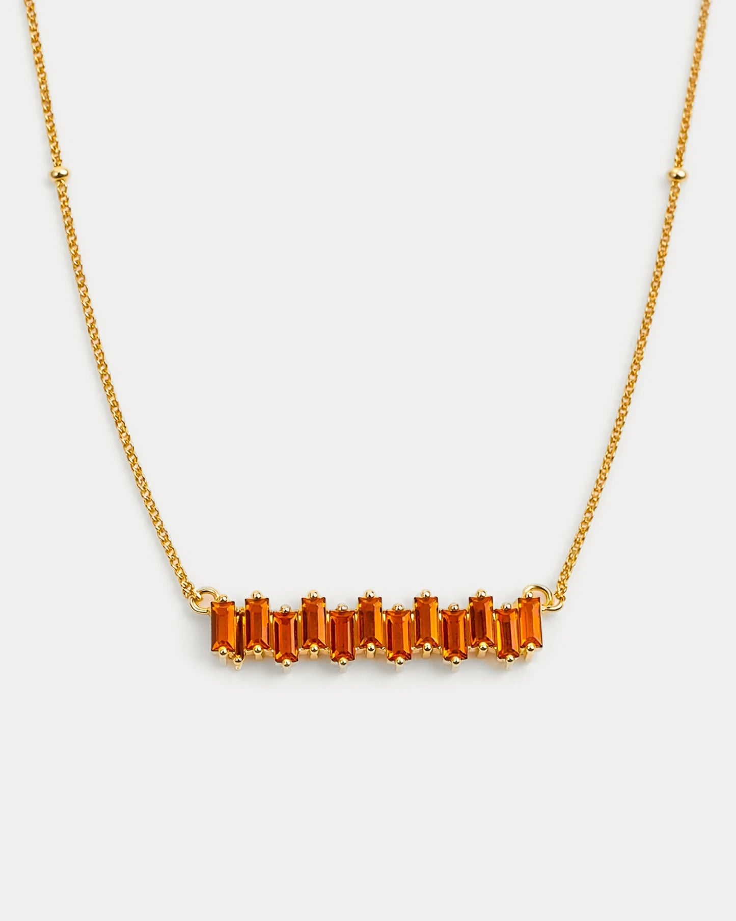 Minimal Sutra Necklace close to skin complementing bold silhouettes and citrine rings