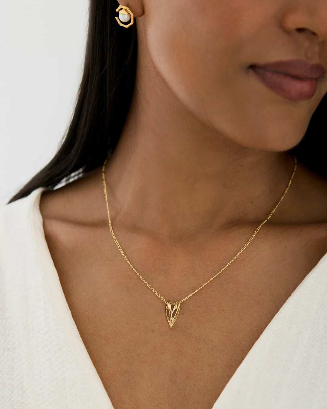 V वी Initial Necklace in gold-tone metal, featuring a delicate chain and a small openwork V-shaped pendant.