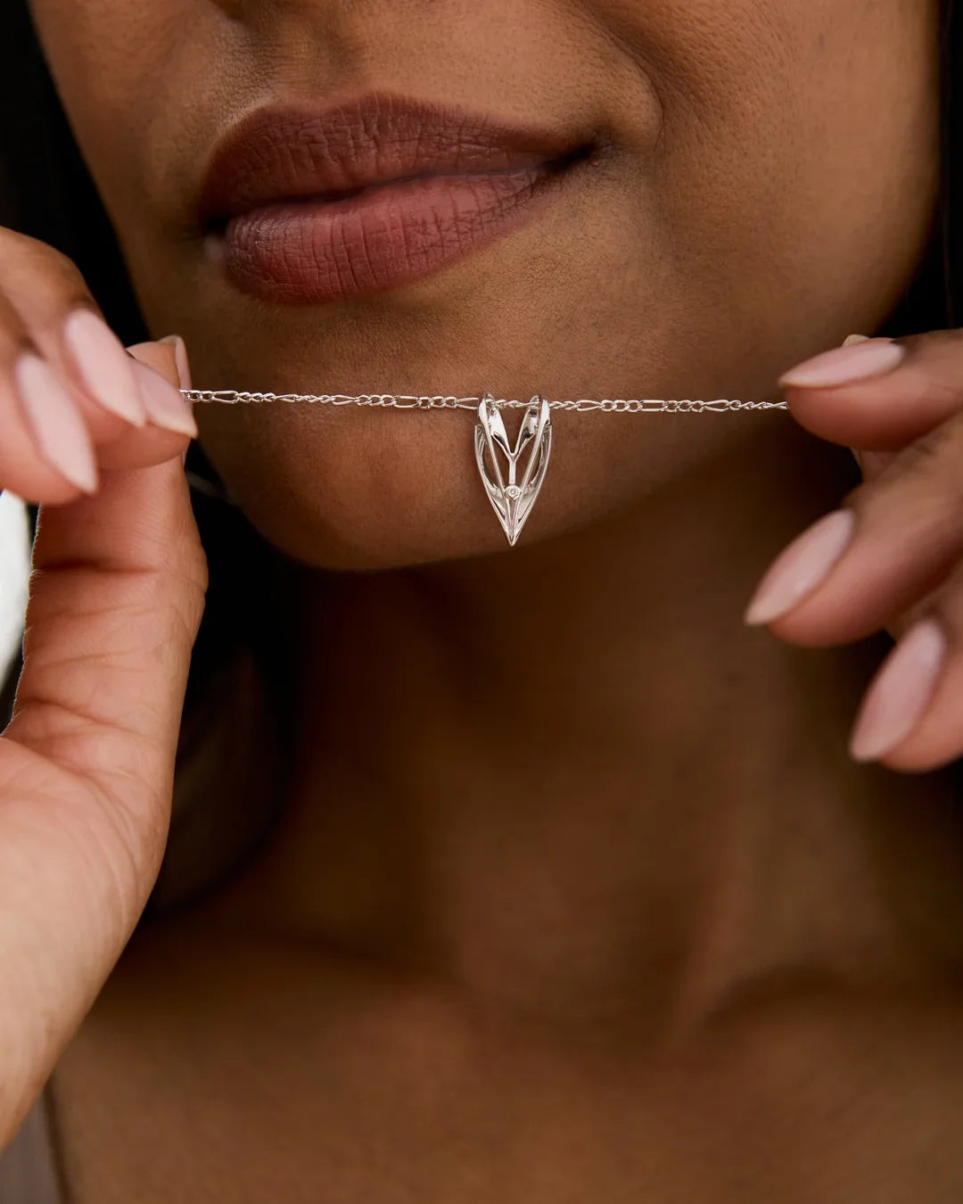 V वी Initial Necklace in silver-toned metal, featuring an openwork V-shaped letter pendant on a delicate chain
