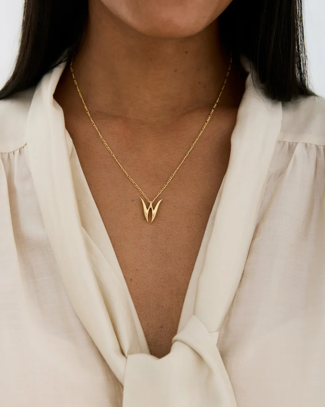 W डब्ल्यू Initial Necklace in gold-tone metal, with a fine chain and polished W-shaped initial pendant
