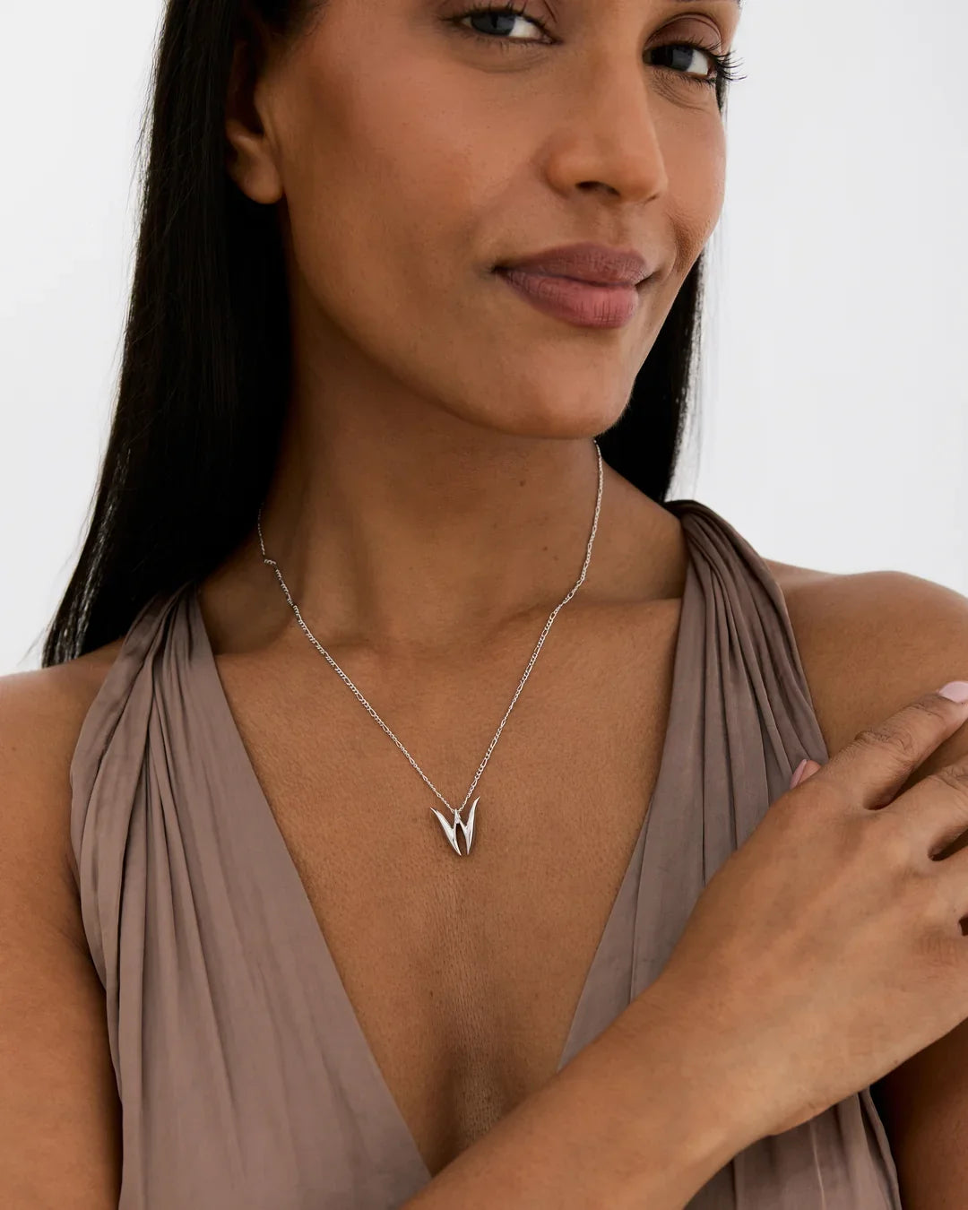 W डब्ल्यू Initial Necklace with a polished silver-tone chain and sculptural double-pointed W pendant.