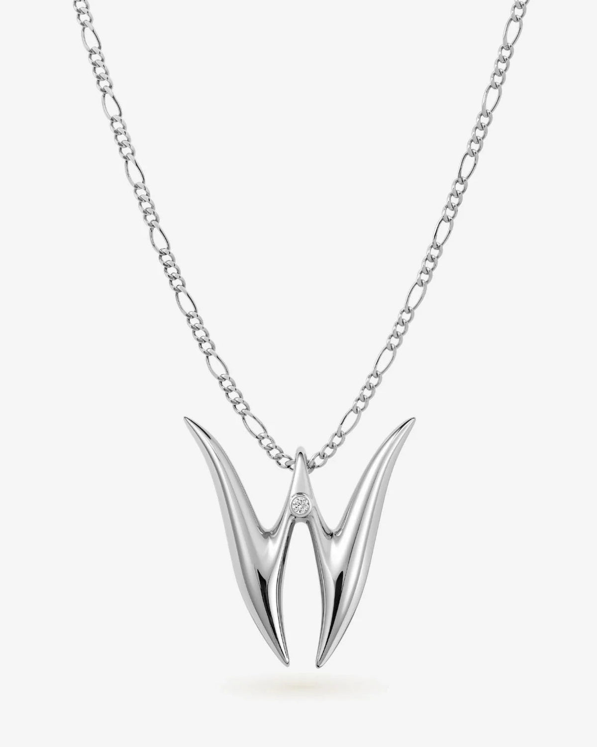 W डब्ल्यू Initial Necklace in polished silver-tone metal, with a sleek sculptural double-pointed W pendant on a fine chain.