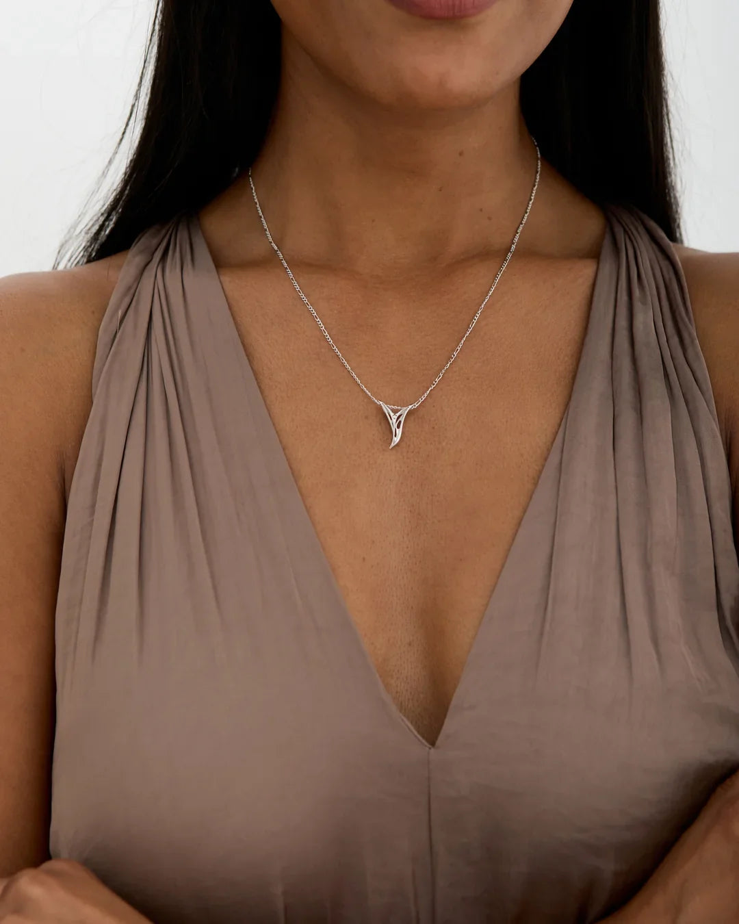 Y वाई Initial Necklace, a delicate silver-tone chain with a polished Y-shaped letter pendant worn at the neckline.