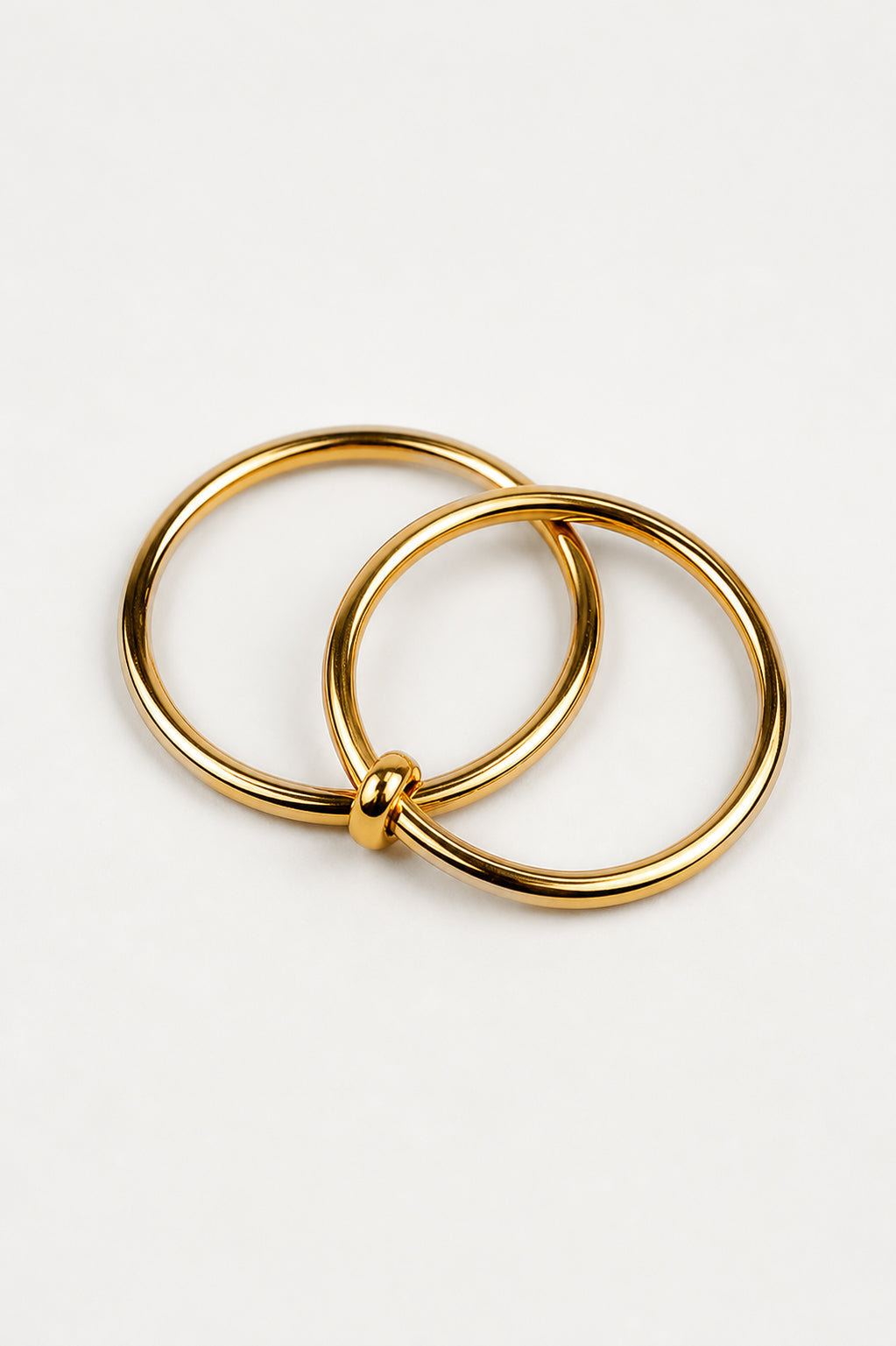 Yugal Ring featuring two interconnected sculptural rings in a modern design symbolizing unity and balance
