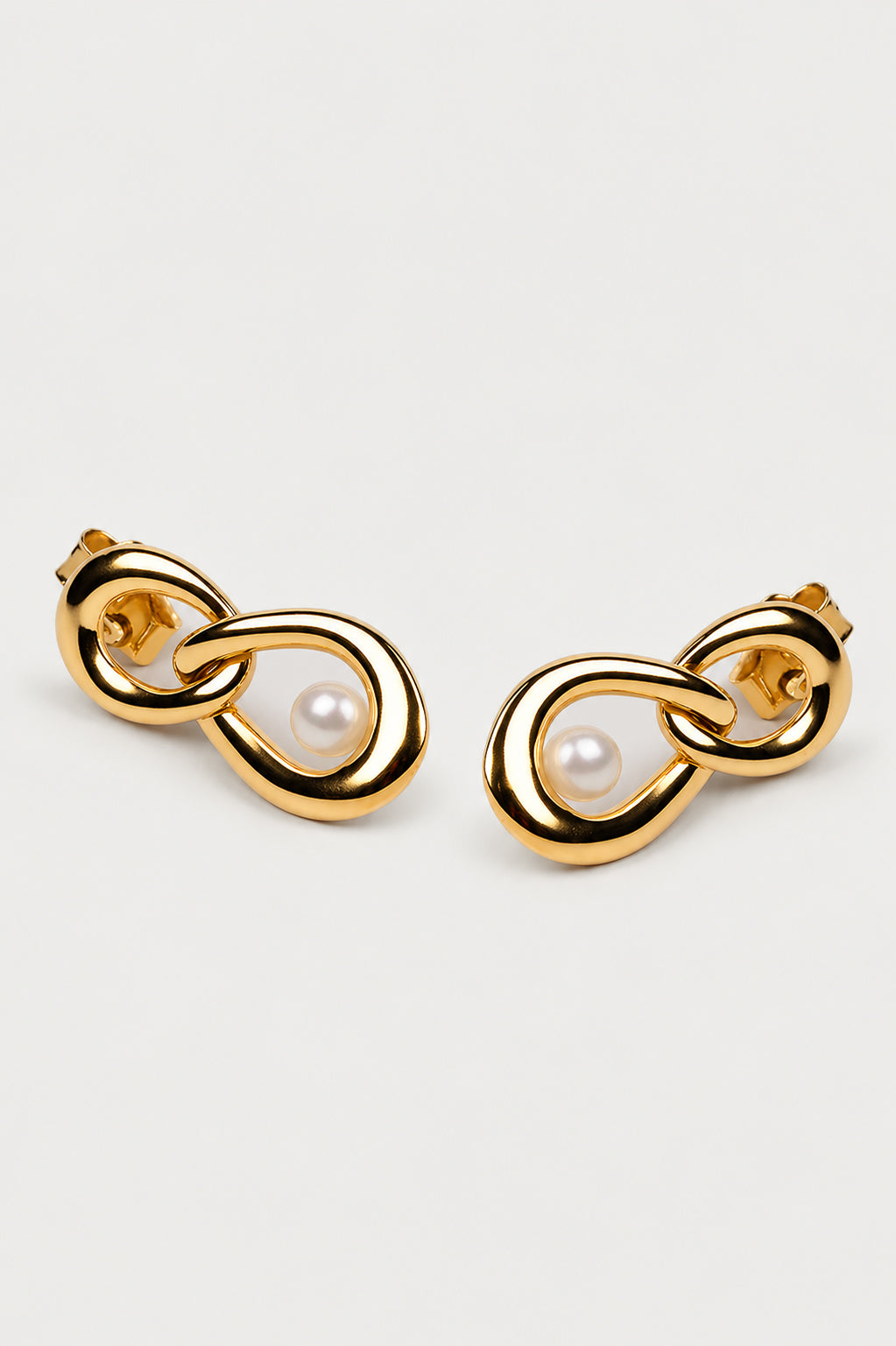 Yukti Earring with two open vertical oval forms in a modern, balanced design